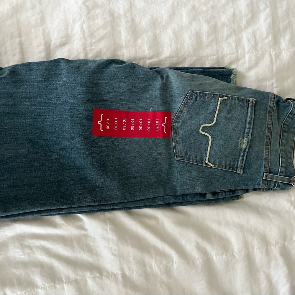 Kim’s Ranch (Olive) Classic Wide-Leg Blue Jeans with fringe hem